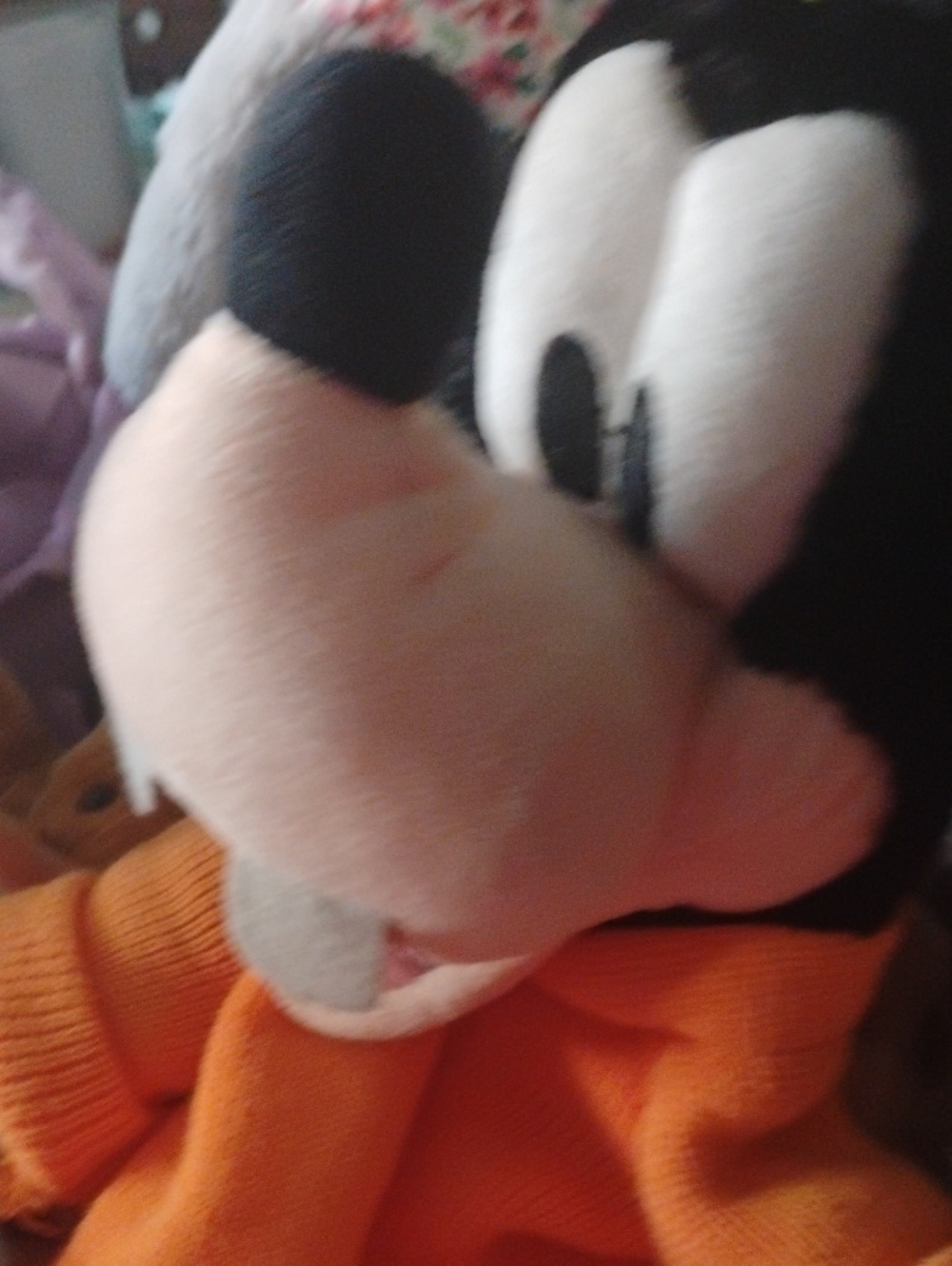Classic Black & White Plush Character with Orange Outfit